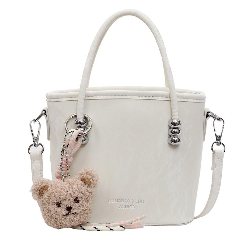 Solid color casual sweet bucket bag women's new solid color fashionable trendy messenger bag commuter simple handbag