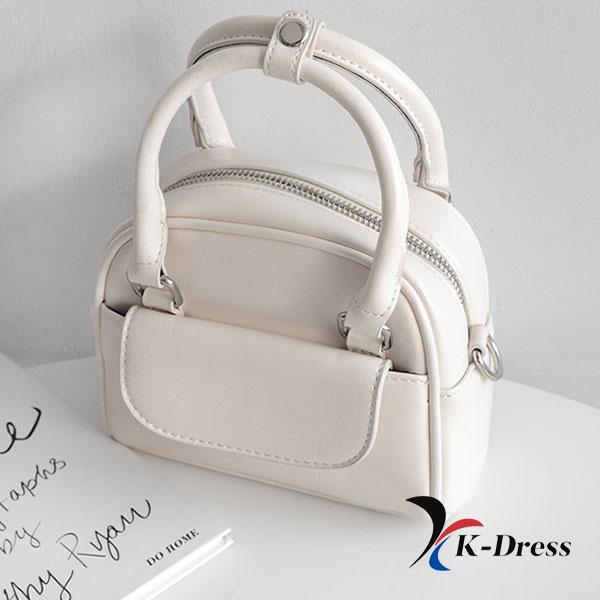 

Шкіряна міні-сумка з хрестовою ручкою та передньою кишенею (4 кольори) 16.5x13x5.5cm слонова кістка