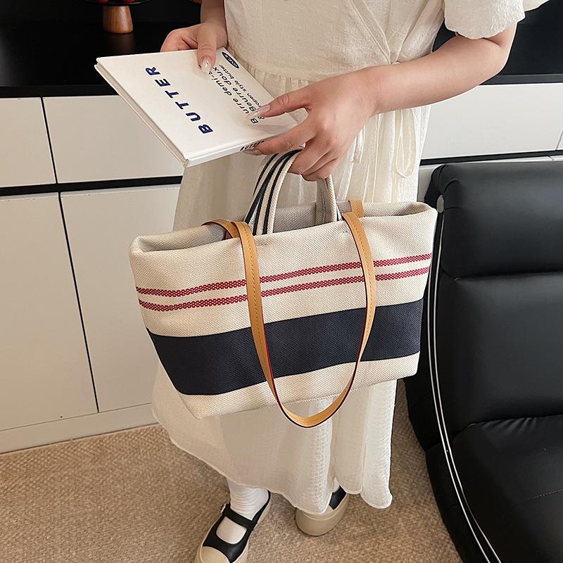 Niche high-end handbag women's 2025 new striped canvas bag large-capacity shoulder underarm commuter bag