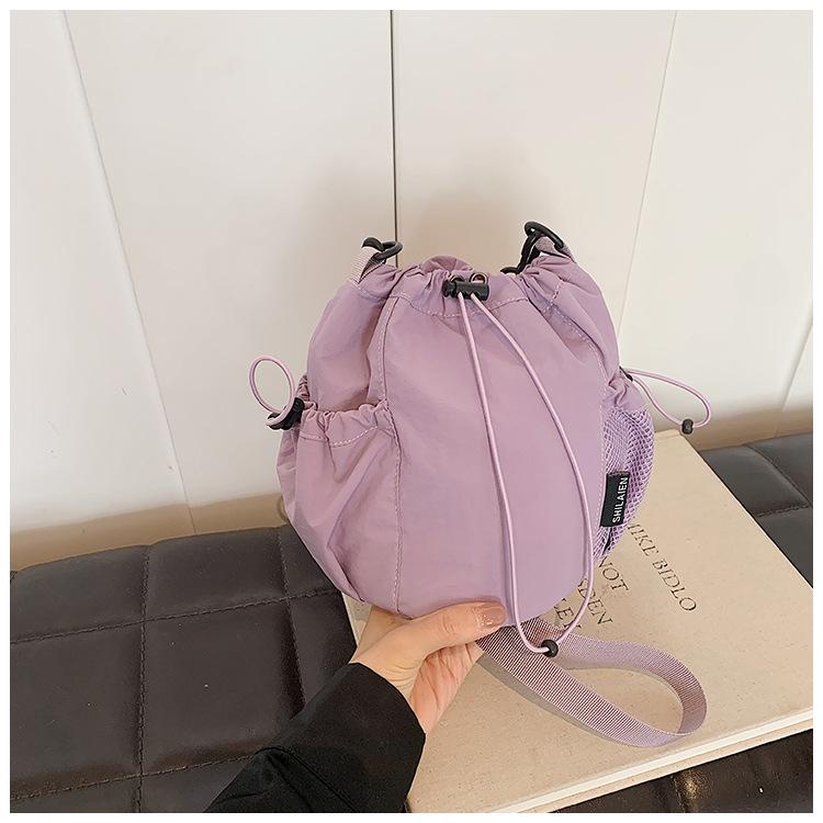 

Новая нейлоновая сумка-ведро женская, высококлассная, легкая, большой вместимости, повседневная, с затягивающимся верхом, на одно плечо, через плечо фиолетовый