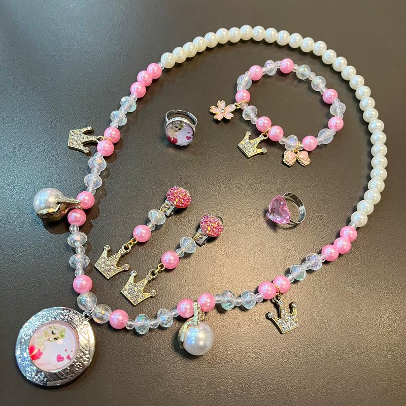 

Набір ювелірних прикрас Ельзи з мультфільму «Крижане серце»: Набір прикрас: намисто, браслет, сережки та каблучка для дітей