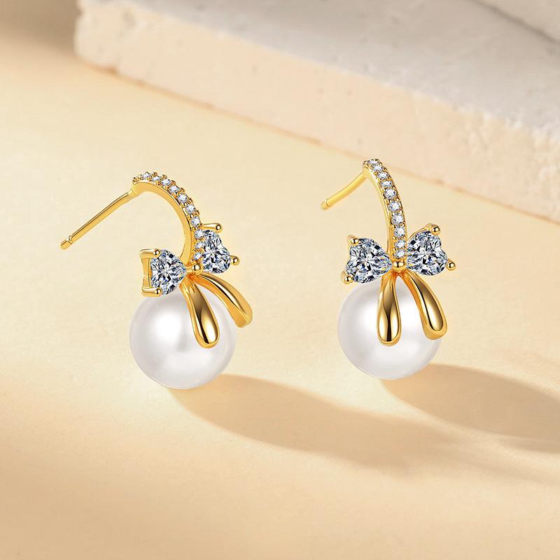Elegant Korean Zircon Bow Pearl Stud Earrings: Stylish, Luxurious, and Versatile Design for Women