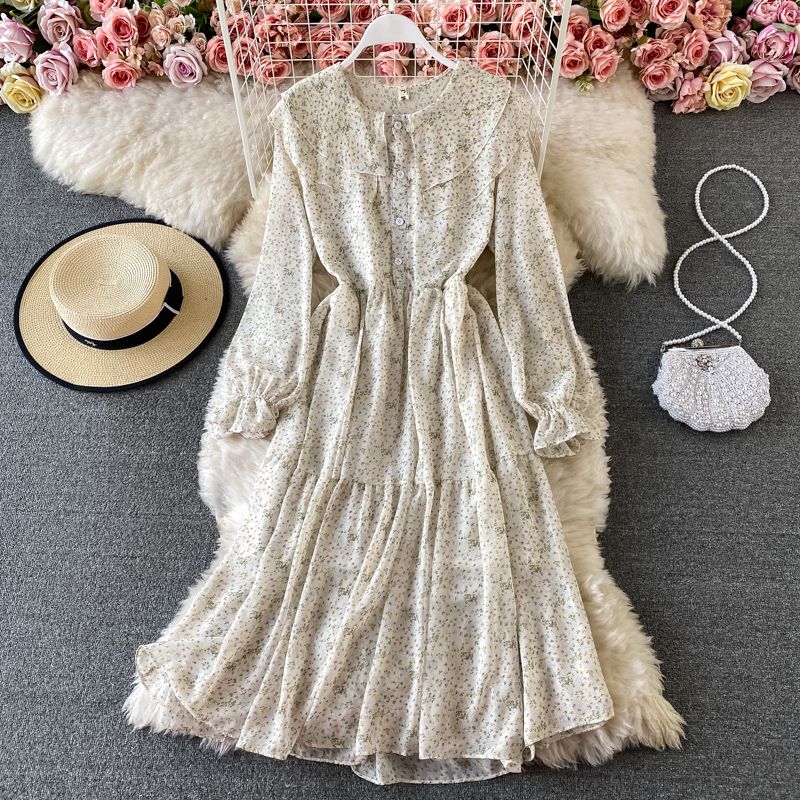 

Нежное шифоновое платье с цветочным принтом Весна 2024 Новое поступление Темпераментный круглый вырез Воланы Приталенный силуэт Ниже колена Платье с широкой юбкой Shallow creamy-white All yards