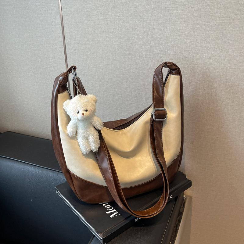 

Premium texture bag women s large capacity 2024 new casual shoulder messenger bag niche design dumpling bag темно-коричневого кольору