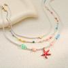 GEMCHIC Damen Bunte Seestern Anhänger Halskette Mehrschichtige Perlenkette Mode Sommer Strand Schmuck