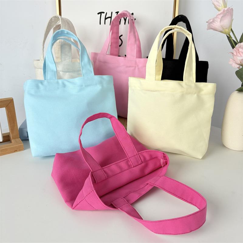 Effenkleurige eenvoudige lunchtas, draagbare canvas tas, kleine stoffen tas, draagbare canvas tas voor het opbergen van diverse spullen