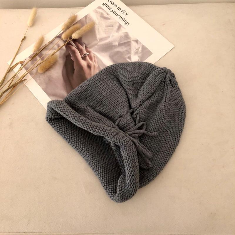 Autumn and winter solid color warm crimped wool hat men's and women's versatile knitted hat fashion street drawstring stacking hat