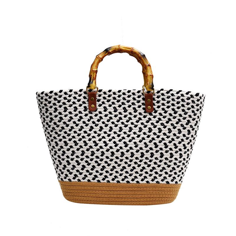 

Large capacity fashion texture simple handbag women s 2025 spring new woven versatile bucket bag tide чорний