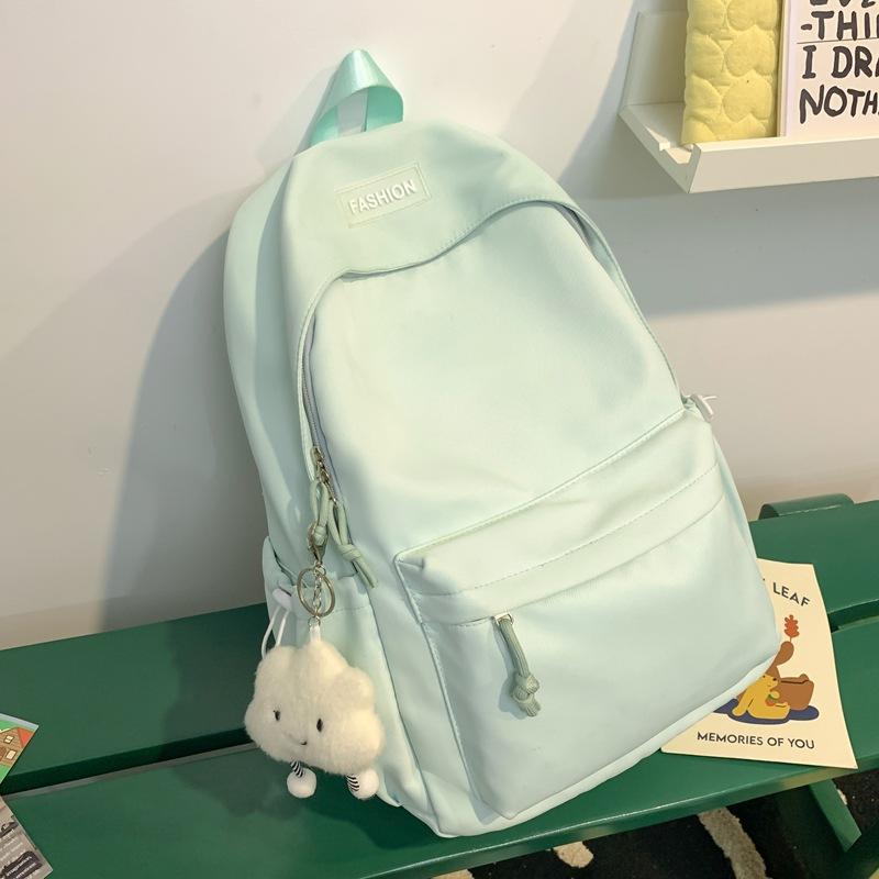 The schoolbag is fresh and sweet, and the solid color is versatile and simple. The schoolbag for junior high school students is light