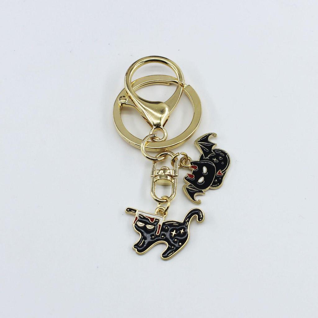 Halloween Cat & Bat Keychain with Wizard Hat, Drip Oil Skull, and Pumpkin Bag Pendant - Alloy Accessories.