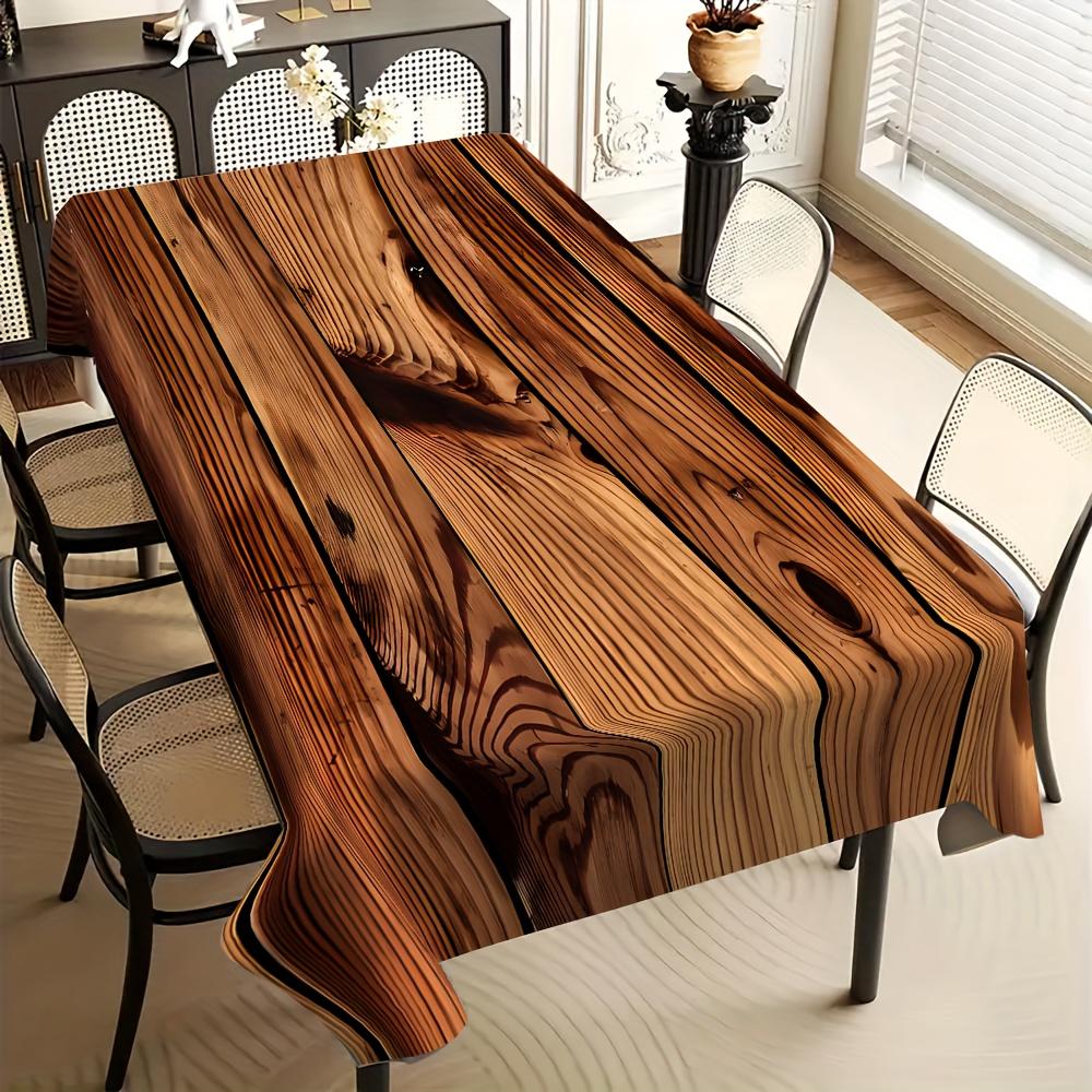 Una tovaglia con motivo a venature di legno, caratterizzata da un design a strisce scure con venature di legno, e che imita la texture del legno naturale