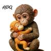 Decorative Monkey Statue Cute Figurine Small Baby Holding Plush Toy Animal Table Centerpiece Desktop Ornament for Living Room Bedroom Office