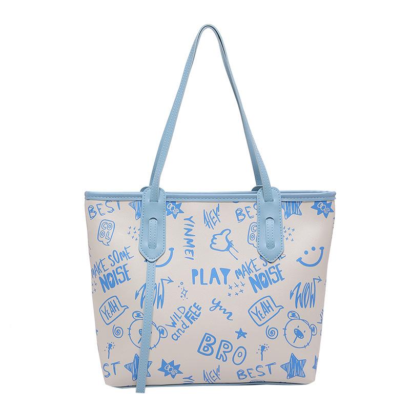 

Contrasting color big bag women s 2024 autumn and winter new cute cartoon printed shoulder bag versatile trendy tote bag синій