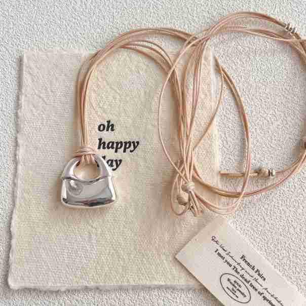 

Silver Thread Embroidery Pendant Necklace: High-End, Adjustable, and Textured Design for Women. бежевий