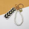 Trending 2025 Keychain Set Fashion Minimalist Pearl Car Keychain Woven Stripe Bag Charm Elegant Women Keychain Organizer Gift