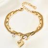 European-American Double Layer Brooch Bracelet with O-Shaped Chain & Rhinestone Heart, 18K Gold-Plated, Personalized & Versatile Wristband.