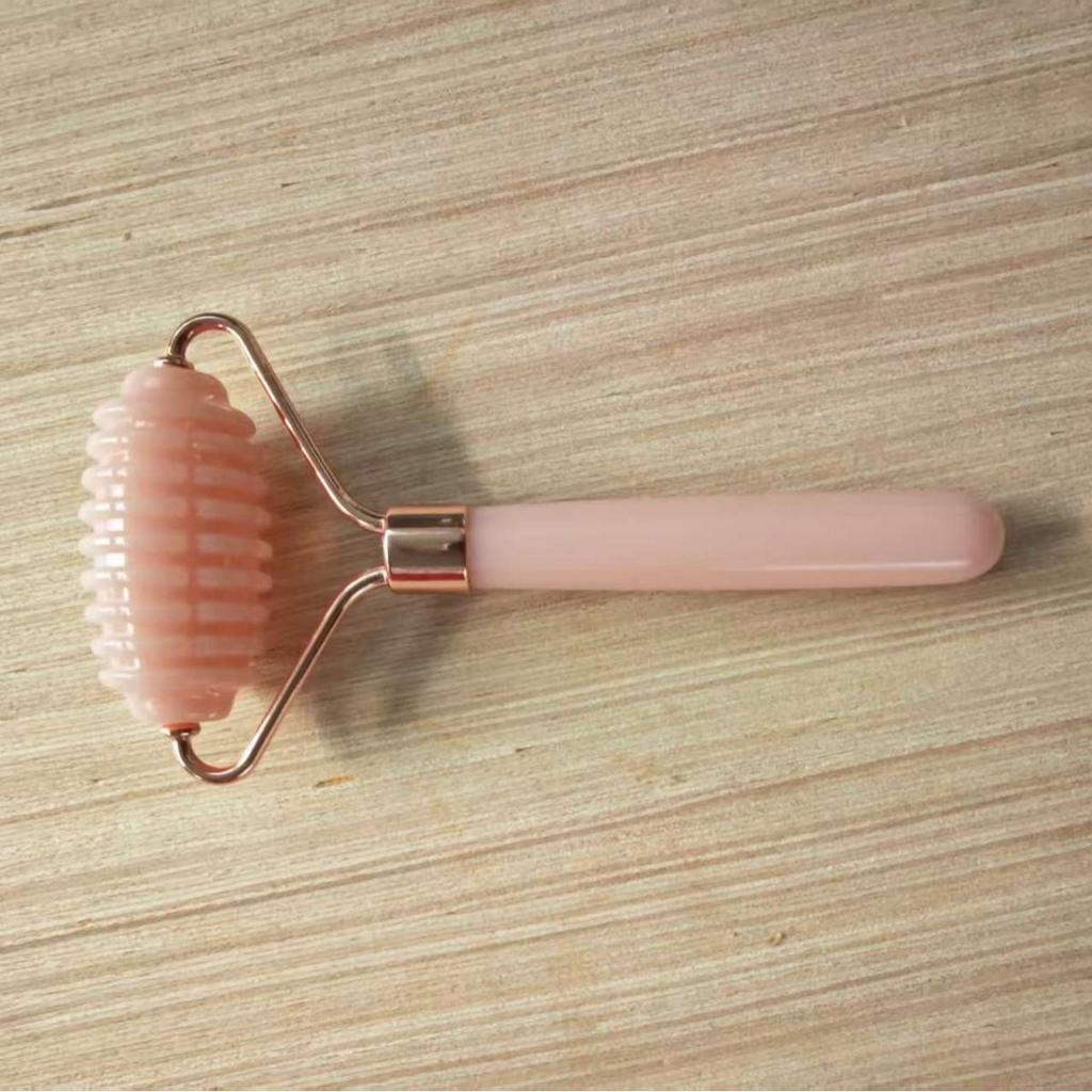 Heart-Shaped Rose Quartz Facial Roller & Gua Sha Massager for Skin Lifting and Muscle Relaxation.