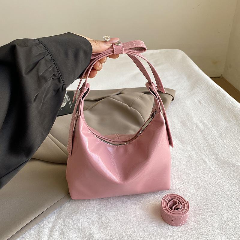 

French niche design handbag bag 2025 autumn new fashionable foreign style high value single shoulder armpit crescent bag розовый