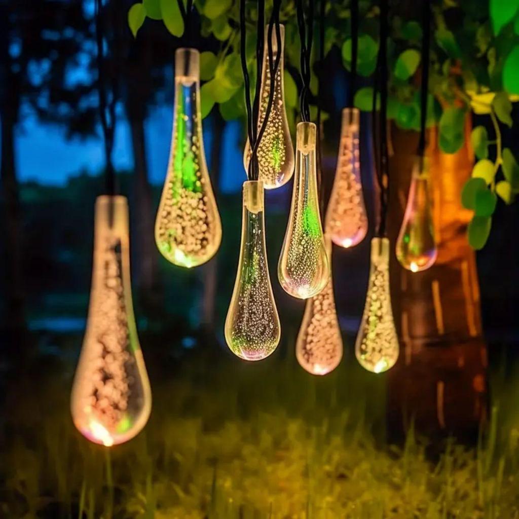 Solar LED Water Drop String Lights: Colorful, Moisture-Proof Decorative Lighting for Festivals, Hotels, and Courtyards with Ground Plug Feature.