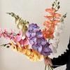Bionic Phalaenopsis Floral Arrangement: Realistic Fake Flower Decor for Living Room or Dining Table.