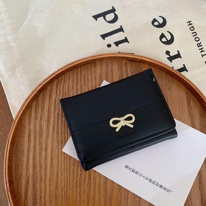 

Женский кошелек инс женский бант простой короткий высококлассный маленький складной чёрный