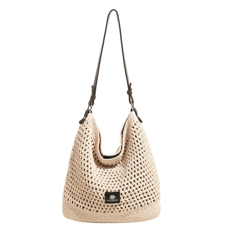Beach woven bag women's new hollow knitted handbag large capacity shoulder crossbody armpit bag