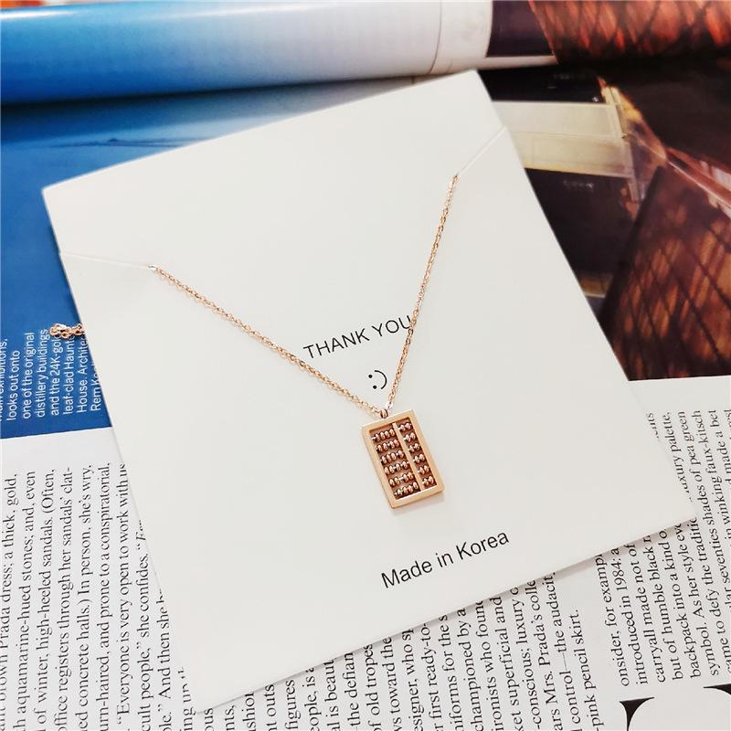 Ruyi Abacus Pendant Necklace: Rose Gold Plated Titanium Steel Chain for Women