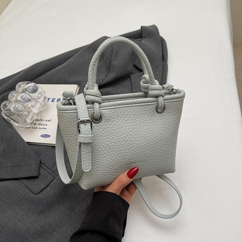 Fashion high-end hand bucket bag spring and summer simple and versatile shoulder bag trendy niche messenger bag