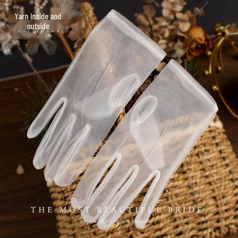 

Свадебные сетчатые перчатки без пальцев с бантом - Молочно-белые, короткие One Size