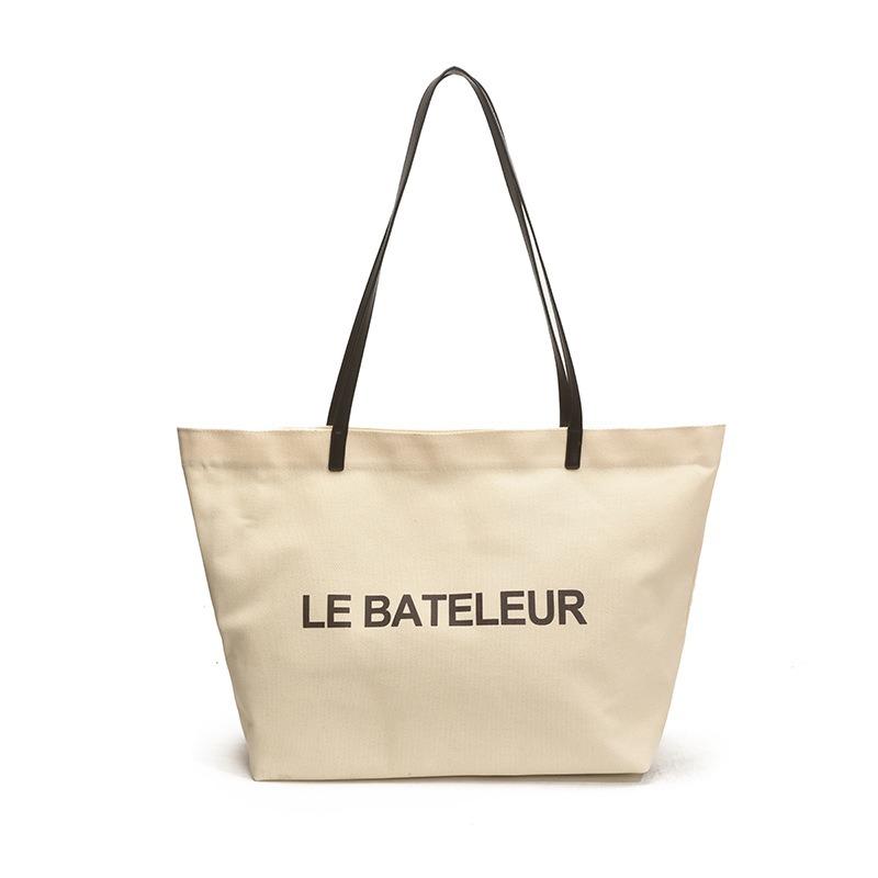 

Large capacity handheld nylon tote bag, new printed alphabet canvas bag, shoulder bag, portable shopping bag.