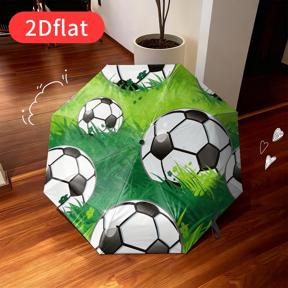 A Football-themed Folding Umbrella - Featuring a Vibrant Green Grass Design with Multiple Black and White Soccer Ball Patterns