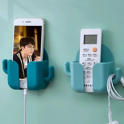 1 pieza Soporte para teléfono móvil sin perforaciones Montaje en pared Soporte Organizador de control remoto Caja de almacenamiento Carga Contenedor de noche Estante Regalo