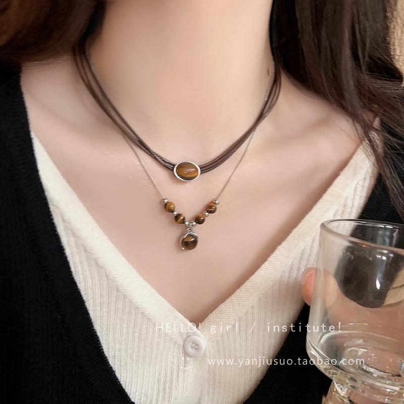 Vintage leather tiger's eye stone pendant necklace women's light luxury niche collarbone chain high-end double-layer stacked sweater chain