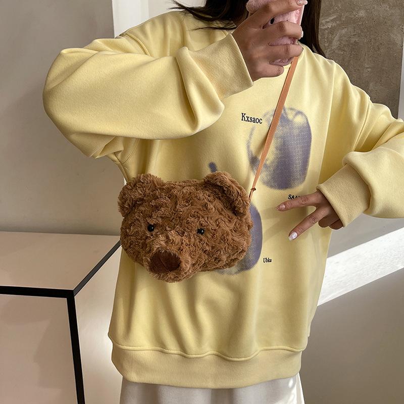 Nisch söt björndocka axelväska dam 2025 ny avslappnad stor kapacitet dubbel axel pälsig tygväska