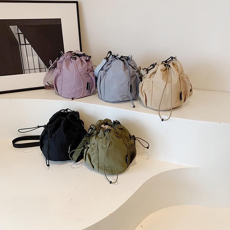 Niche Design Nylon Bucket Bag Women's 2026 Spring New Fashion Super Fire Drawstring Shoulder Messenger Bag