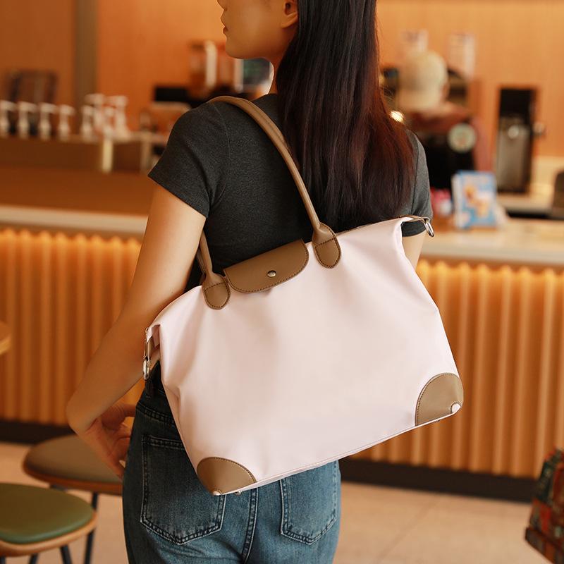 Simple and casual handbag tote bag, dumpling bag, women's briefcase, niche high-end large-capacity crossbody commuter bag