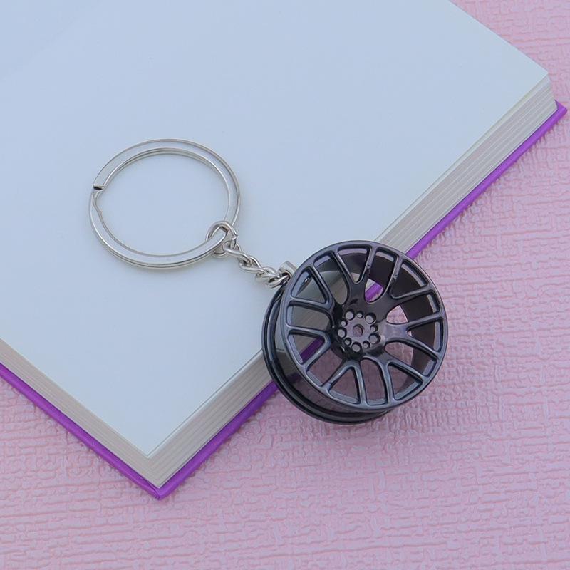 Creative Car Wheel Hub Keychain: Zinc Alloy Metal, Customizable Gift.
