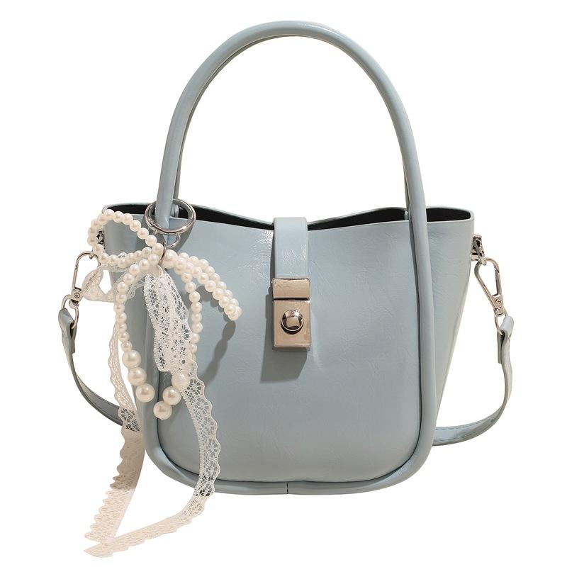 Spring and Summer New Casual Simple High-end Oil Wax Leather Portable Bucket Bag Korean Version Niche Design Solid Color Messenger Bag