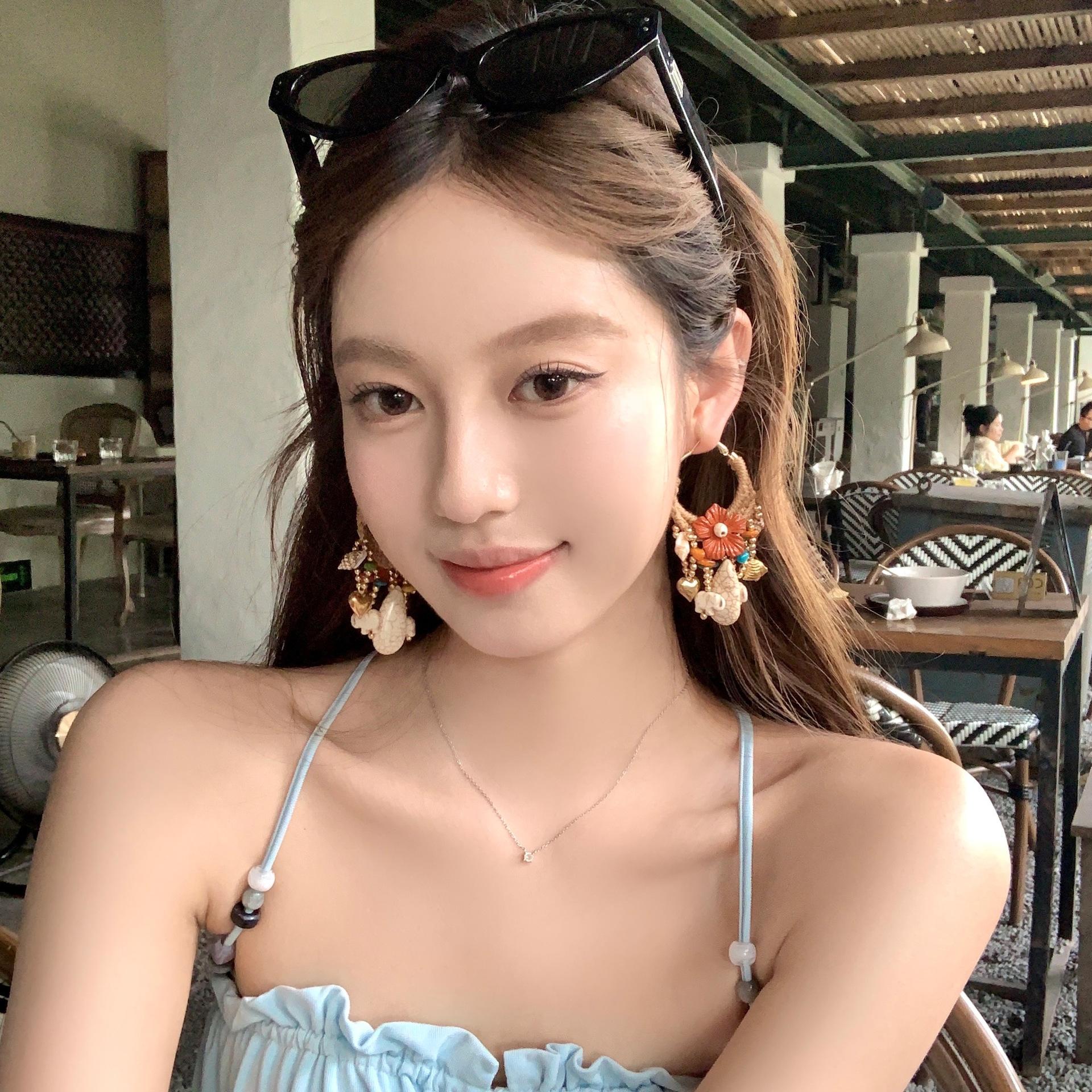 

Silver needle woven flower water drop starfish fringed earrings seaside vacation style temperament earrings niche high-end earrings