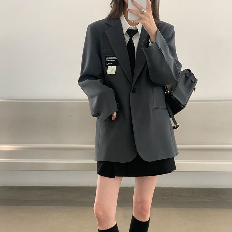 Manteau blazer élégant et coupe ample pour femme, parfait pour le streetwear.