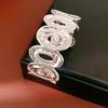 Spiral Lumina Oval Hollow Metal Statement Bracelet-Hand Ring with High-End Niche Appeal