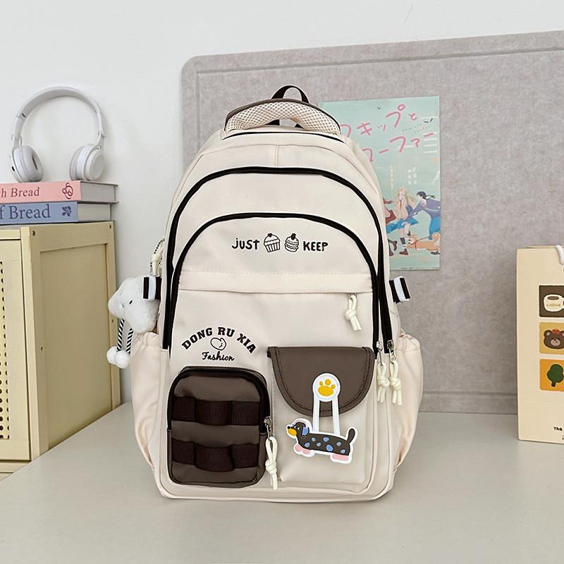 Simplified And Cake Letter Printed Student Casual Backpack With Plueh Pendant