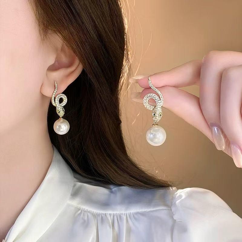 

Unique Zircon Snake Pearl Earrings – Feminine, Stylish, and Versatile Design