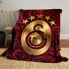 Golden emblem with "1905" and stars, surrounded by red floral patterns. for all seasons blanket lunch break throw gift