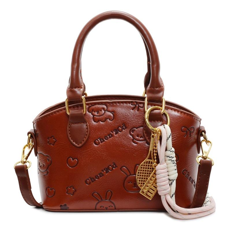 

Korean version of the new casual temperament cute embossed portable bucket bag high-end commuter niche design messenger bag women коричневий