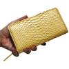 This gold long wallet for men and women is made from a single piece of genuine snakeskin leather. It features a round zipper, a coin purse, and card