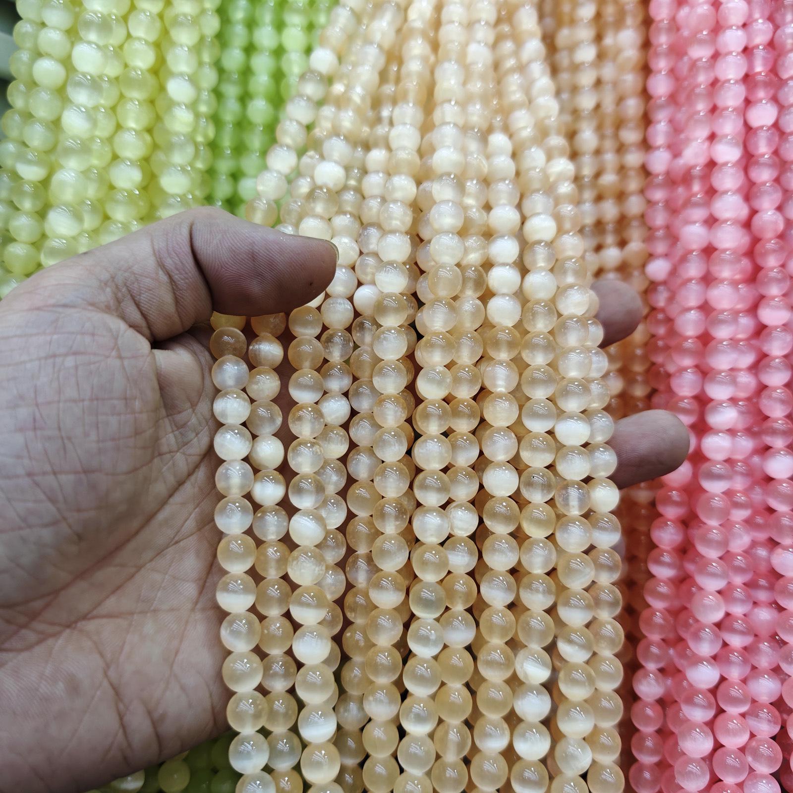 

8.5mm Natural Colored Gypsum Stone Beads with Strong Cat s Eye Effect for DIY Jewelry. 8.5mm Approx. 43 Beads