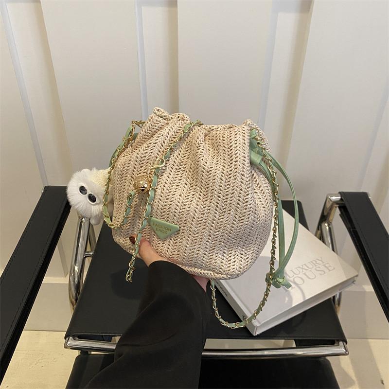 

Unique Stylish Woven Bucket Bag For Women In Green Khaki White And Pink Colors With Chic Chain Strap Without Pendant
