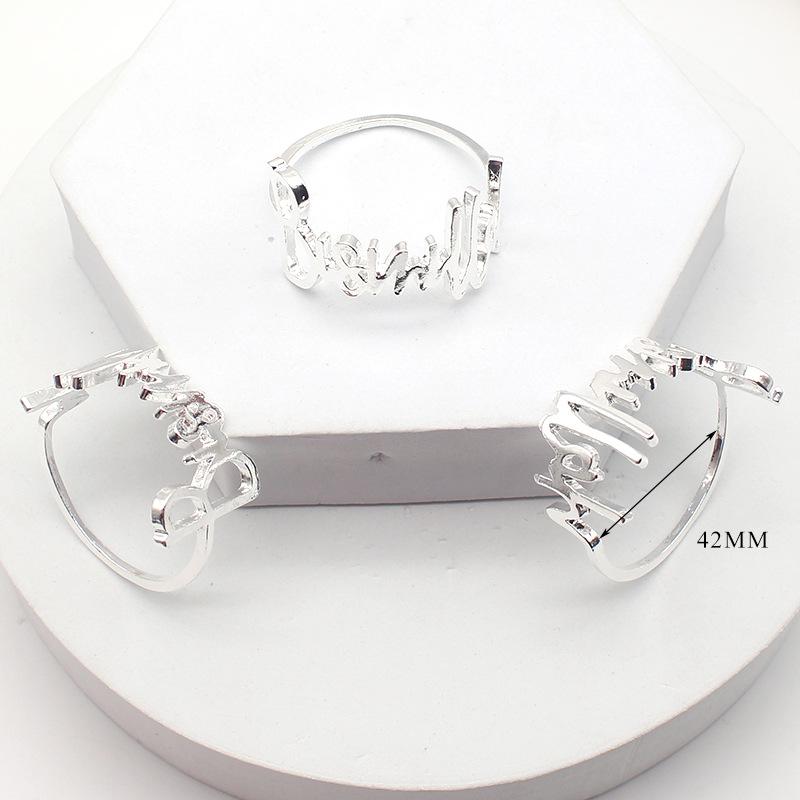 

10PCS Нове кільце для серветок з літерами Західний ресторан Пряжка для серветок Готель Весільні кільця для серветок Прикраса столу та аксесуари