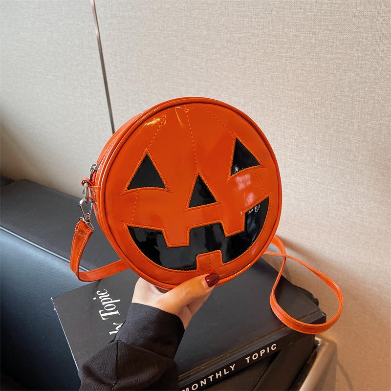 

Halloween pumpkin small bag female 2025 new European and American fashion niche funny ghost tide cool messenger small round bag чорний